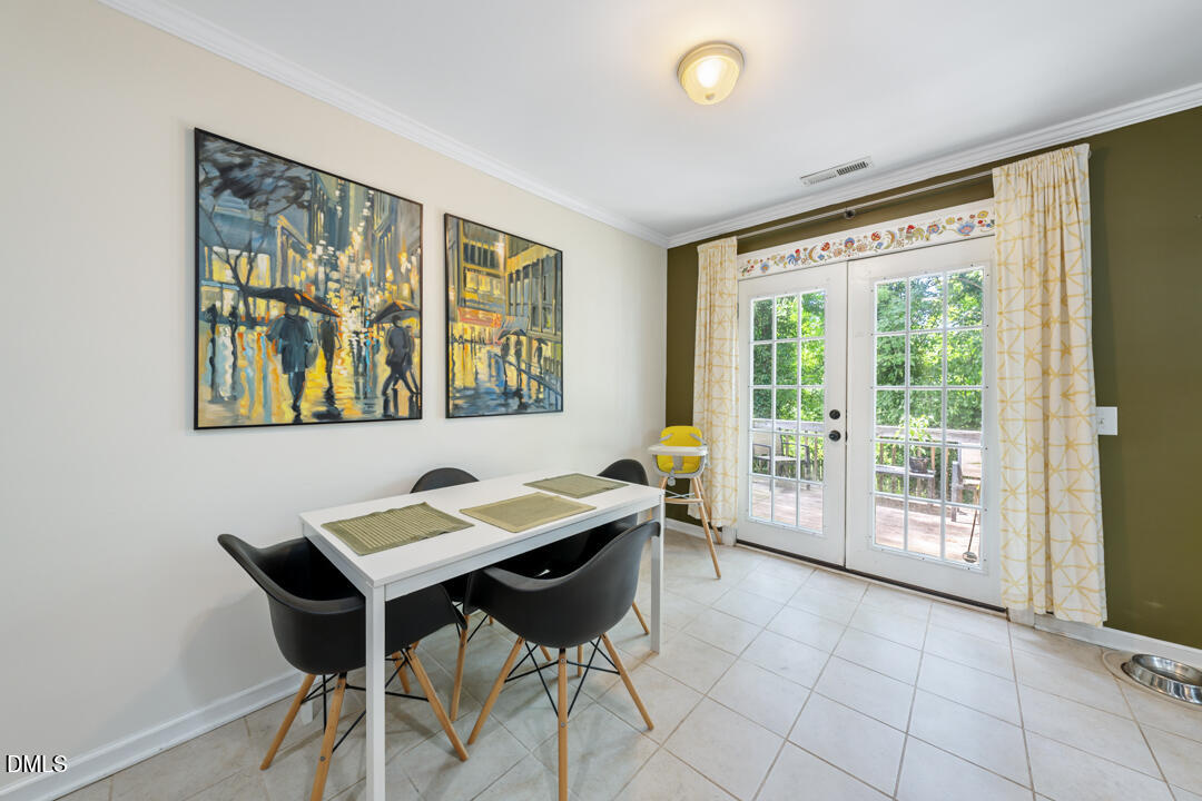 806 South Roxboro Street Durham, NC 27707 - Photo 8 of 25 a view of a dining room with furniture and a large window