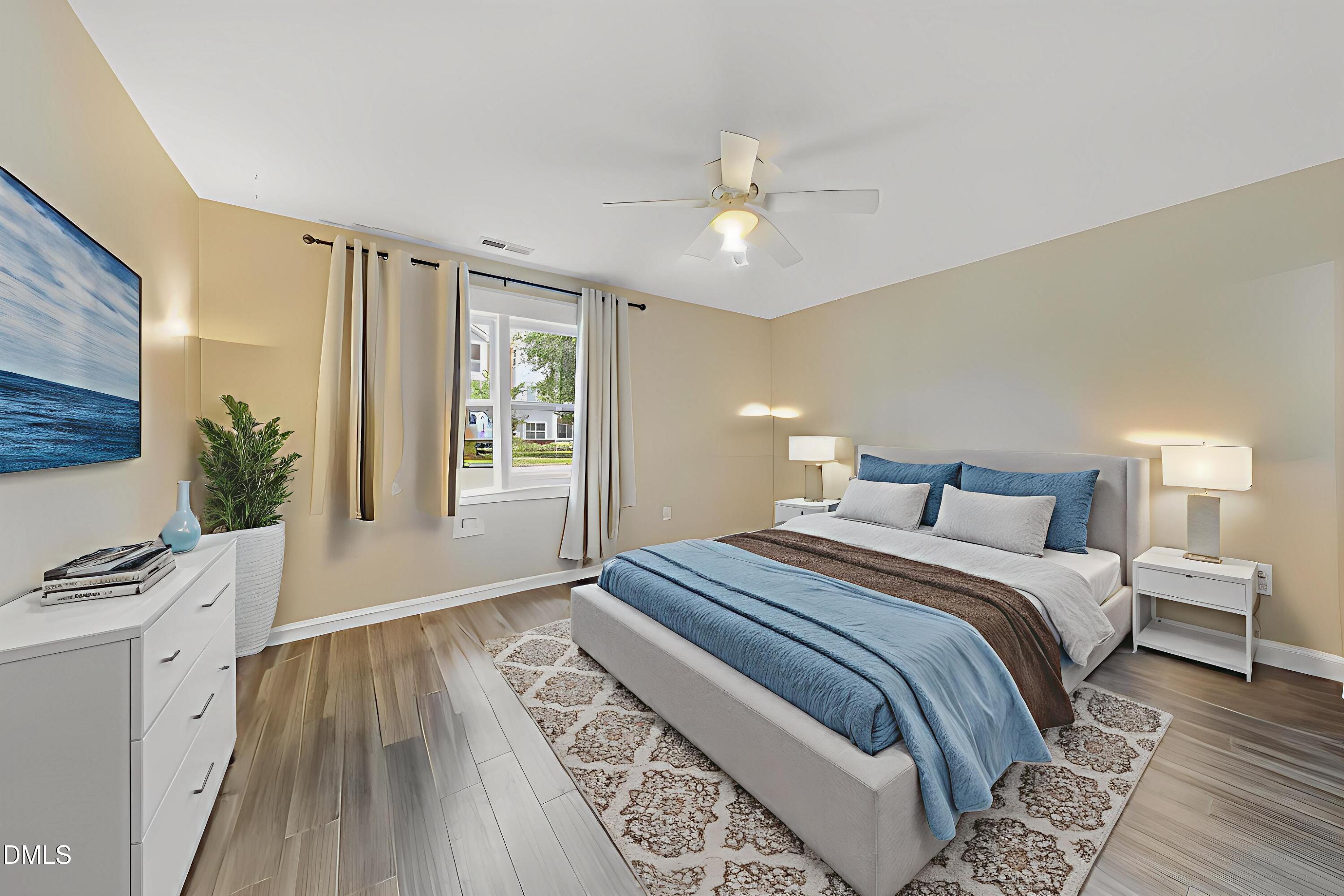 806 South Roxboro Street Durham, NC 27707 - Photo 9 of 25 a bedroom with a bed and a window