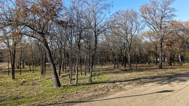 walk in wooden floor with white walls