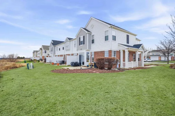 a view of a house with a back yard