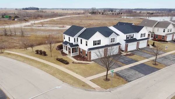 a terrace of a house with outdoor seating