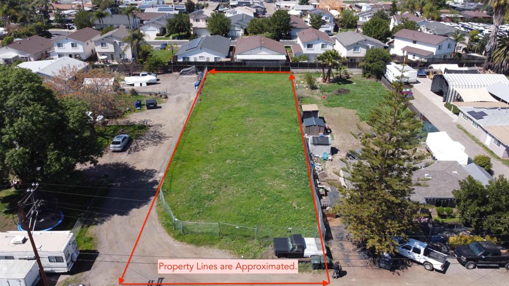an aerial view of a house with a garden and swimming pool
