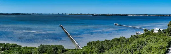 an aerial view of a house with a lake view
