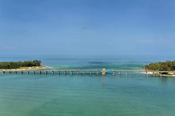 a view of lawn chairs and an ocean view