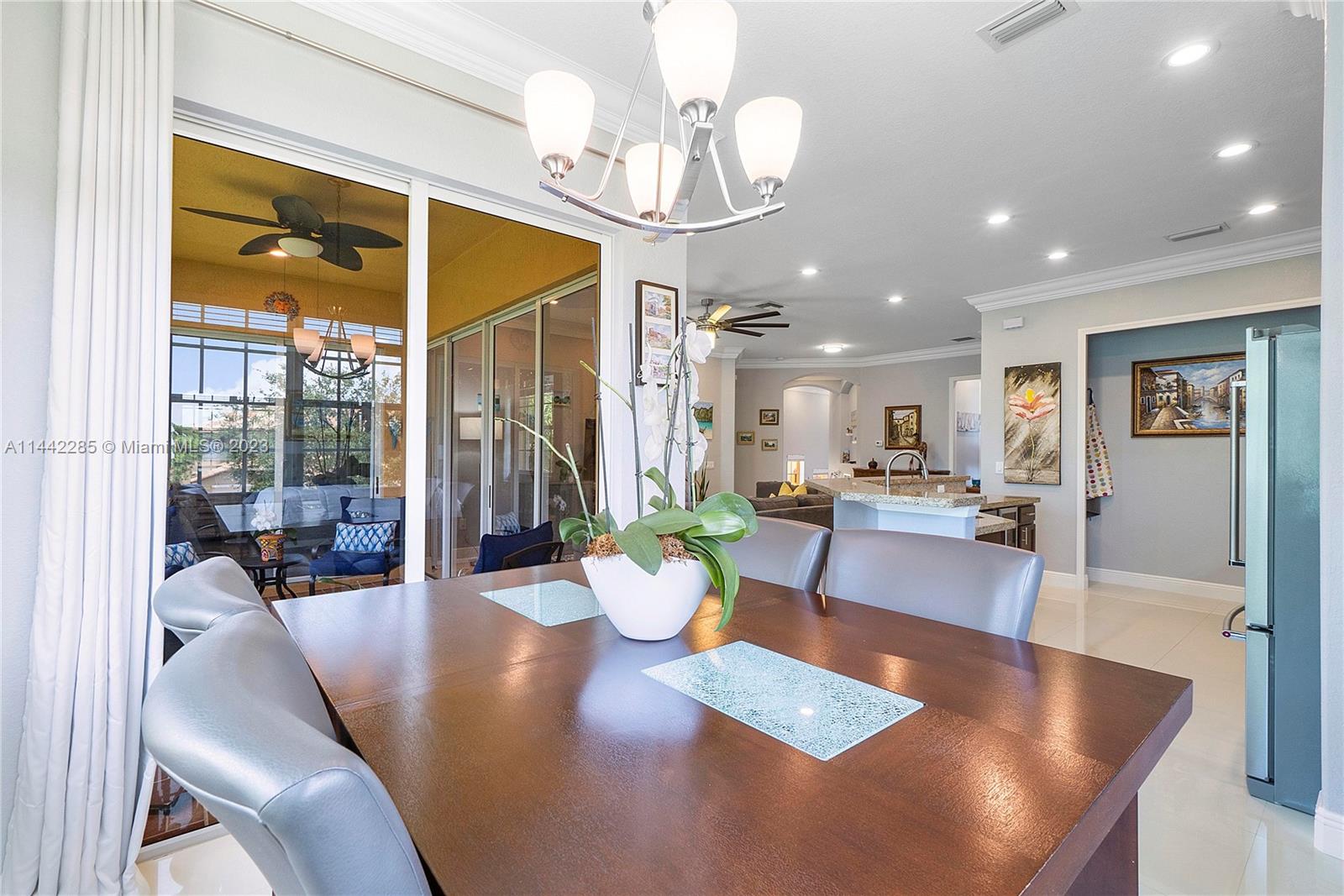 Heron Bay Parkland, FL 33076 - Photo 14 of 60 a living room with dining table furniture and a large window