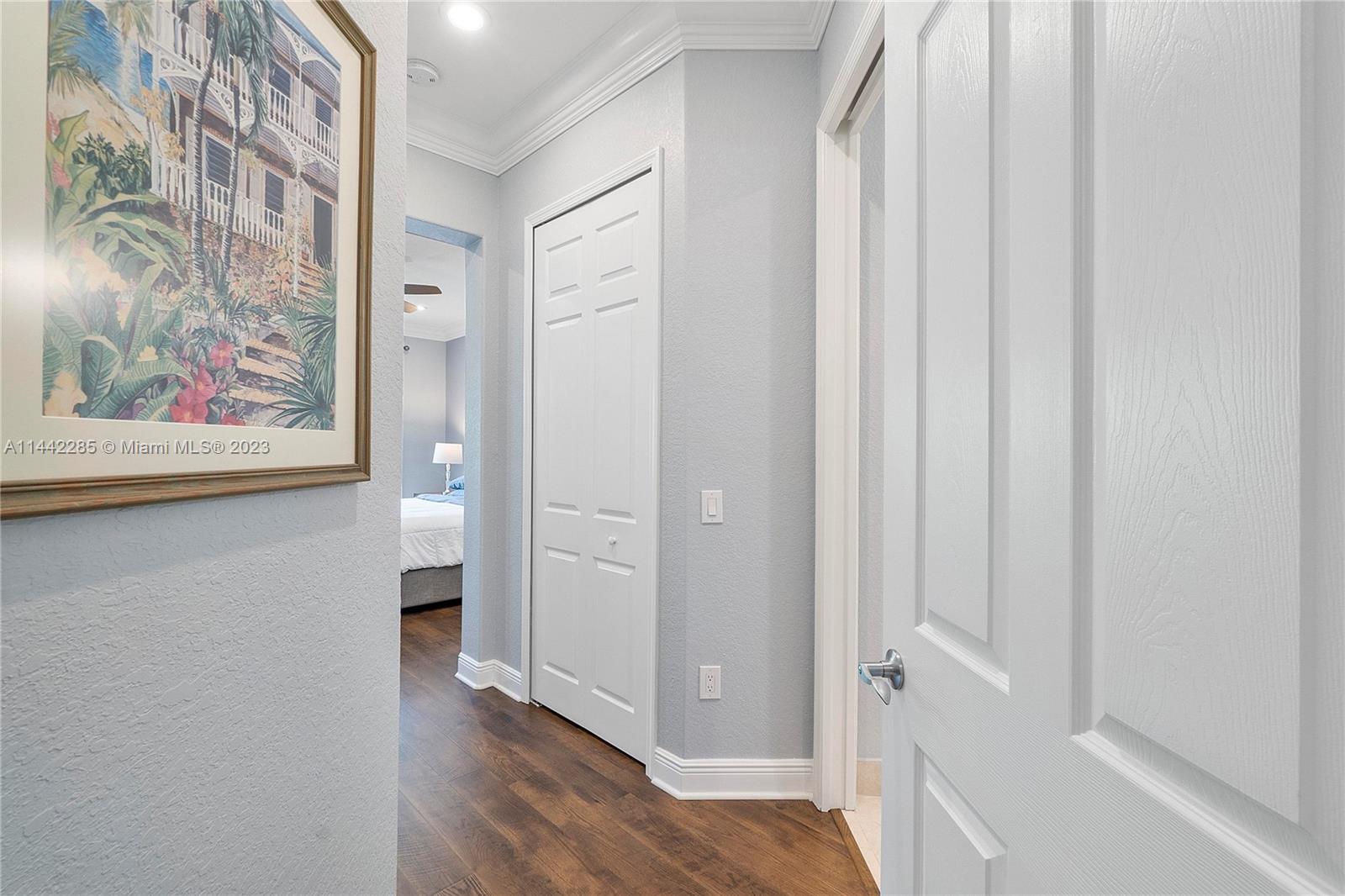 Heron Bay Parkland, FL 33076 - Photo 21 of 60 a view of a bathroom with a sink and wooden floor
