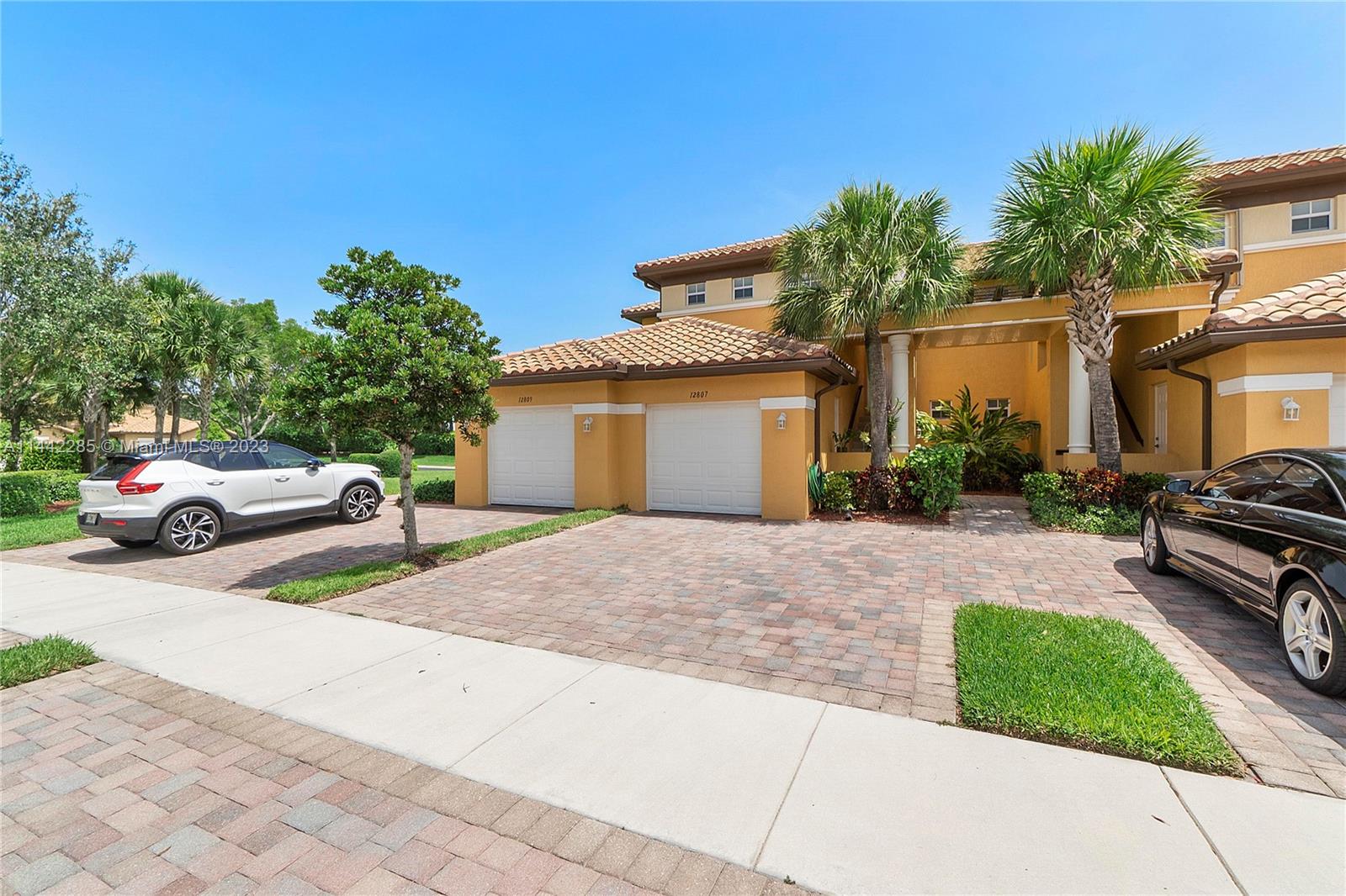 Heron Bay Parkland, FL 33076 - Photo 3 of 60 a view of a car parked in front of a house