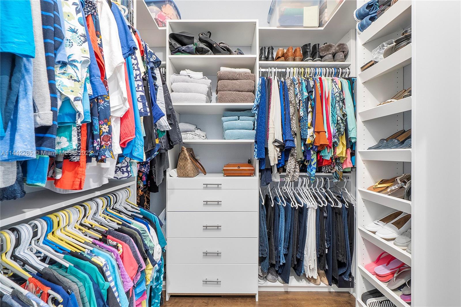 Heron Bay Parkland, FL 33076 - Photo 31 of 60 a view of walk in closet with clothes and shoes