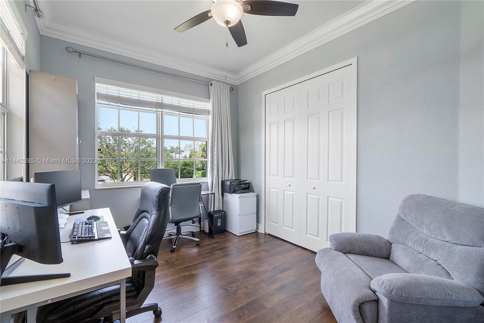 Heron Bay Parkland, FL 33076 - Photo 35 of 60 a living room with furniture and a window