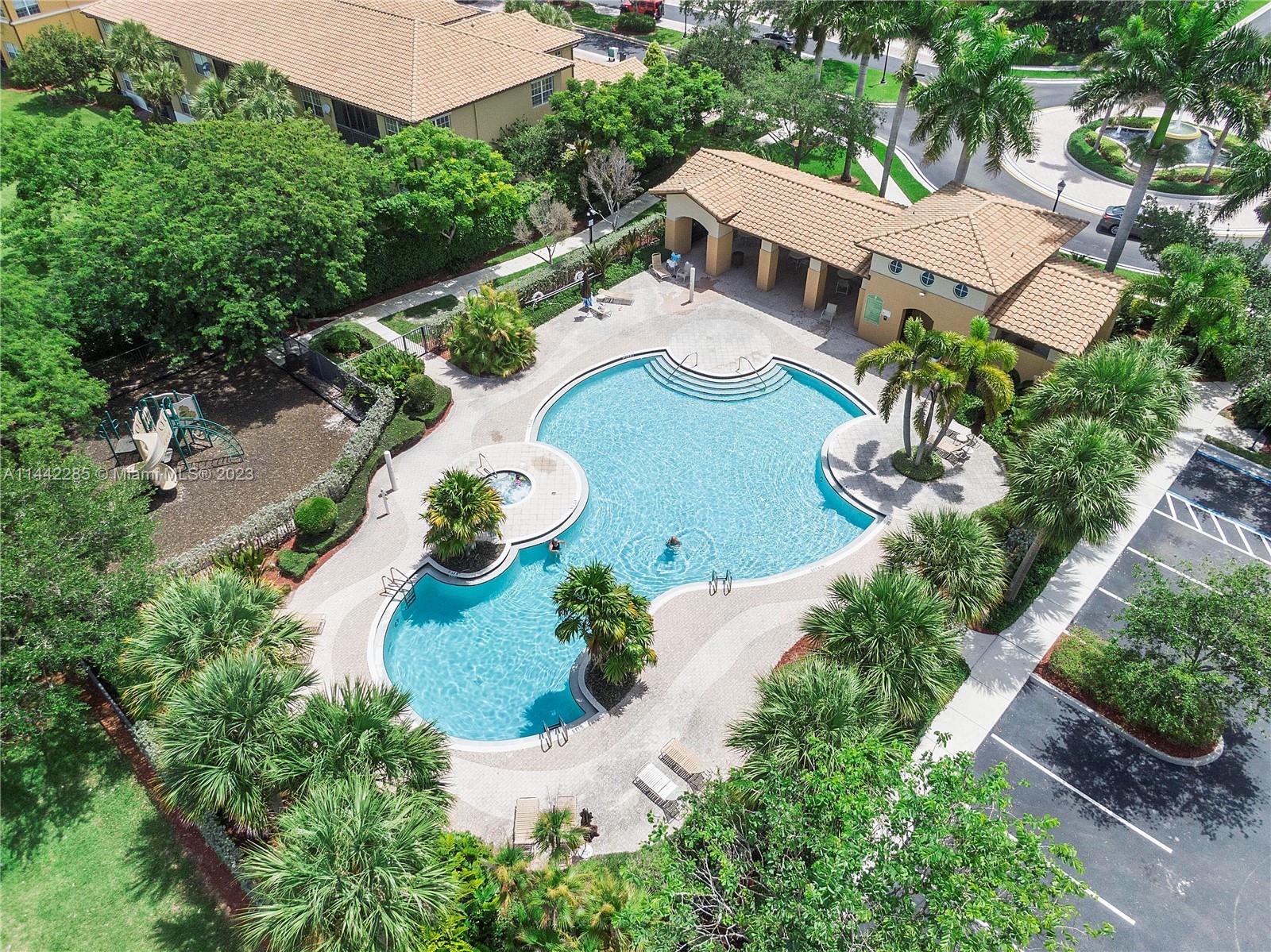 Heron Bay Parkland, FL 33076 - Photo 53 of 60 an aerial view of house with yard