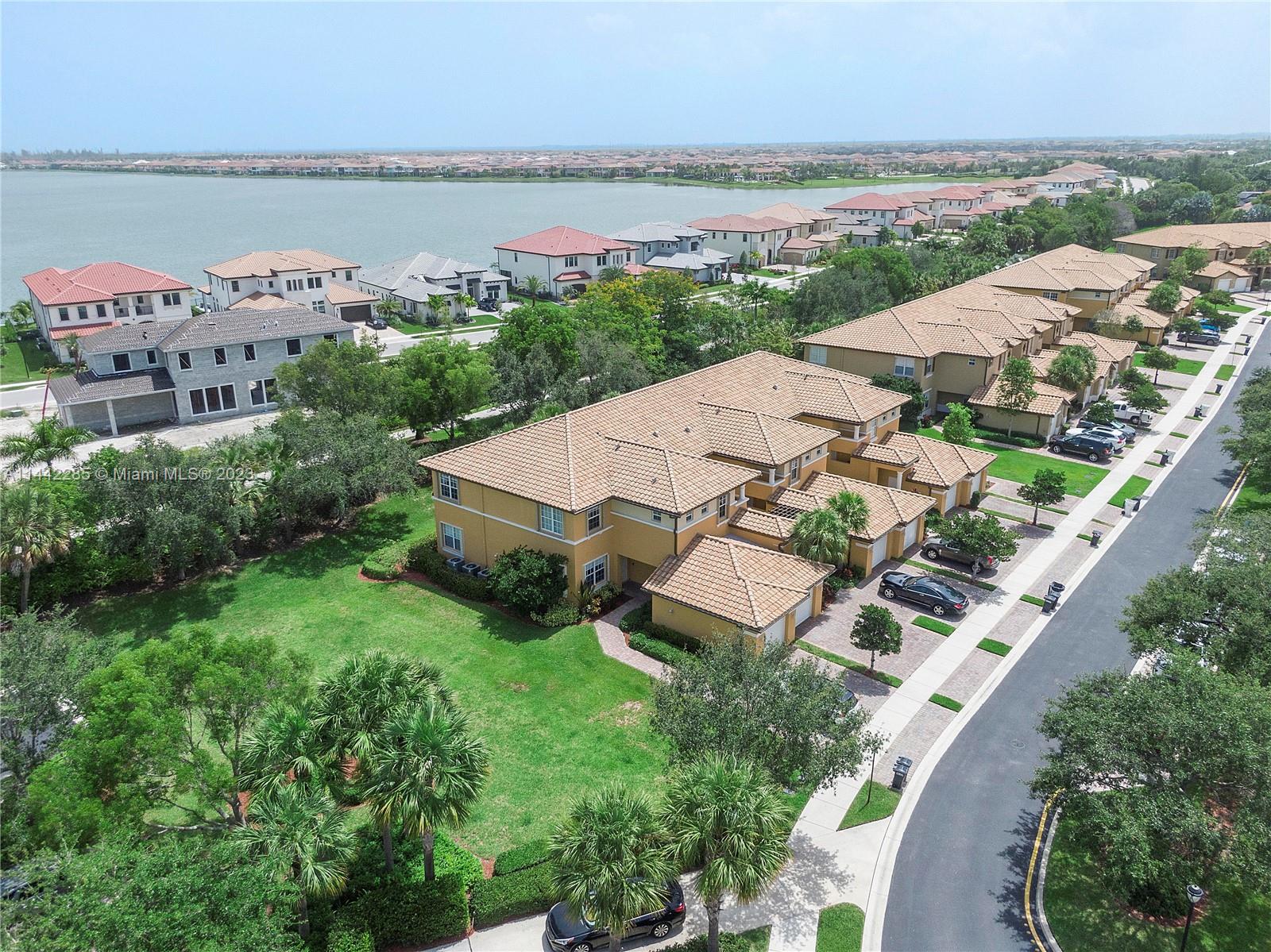Heron Bay Parkland, FL 33076 - Photo 59 of 60 an aerial view of a house with outdoor space and lake view