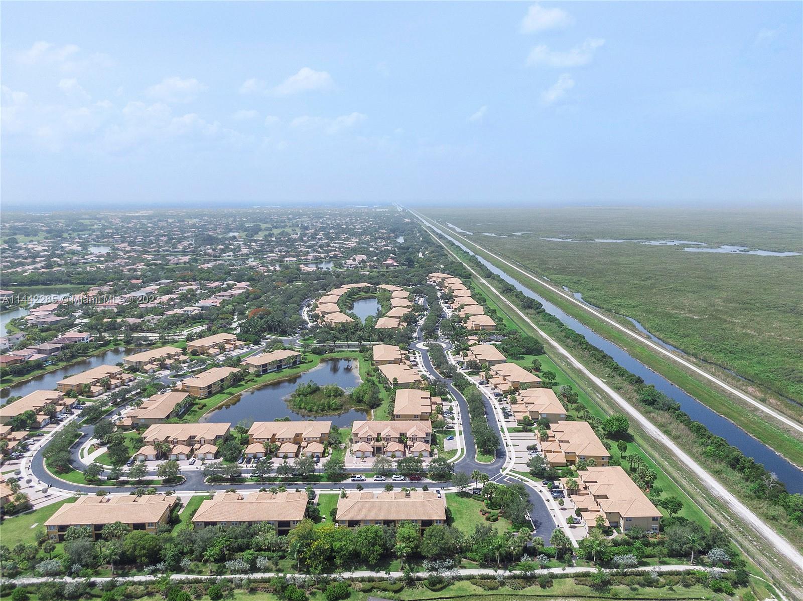 Heron Bay Parkland, FL 33076 - Photo 60 of 60 an aerial view of residential building with outdoor space and ocean view