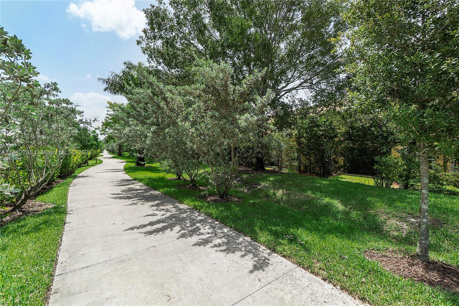 Heron Bay Parkland, FL 33076 - Photo 7 of 60 a view of a street