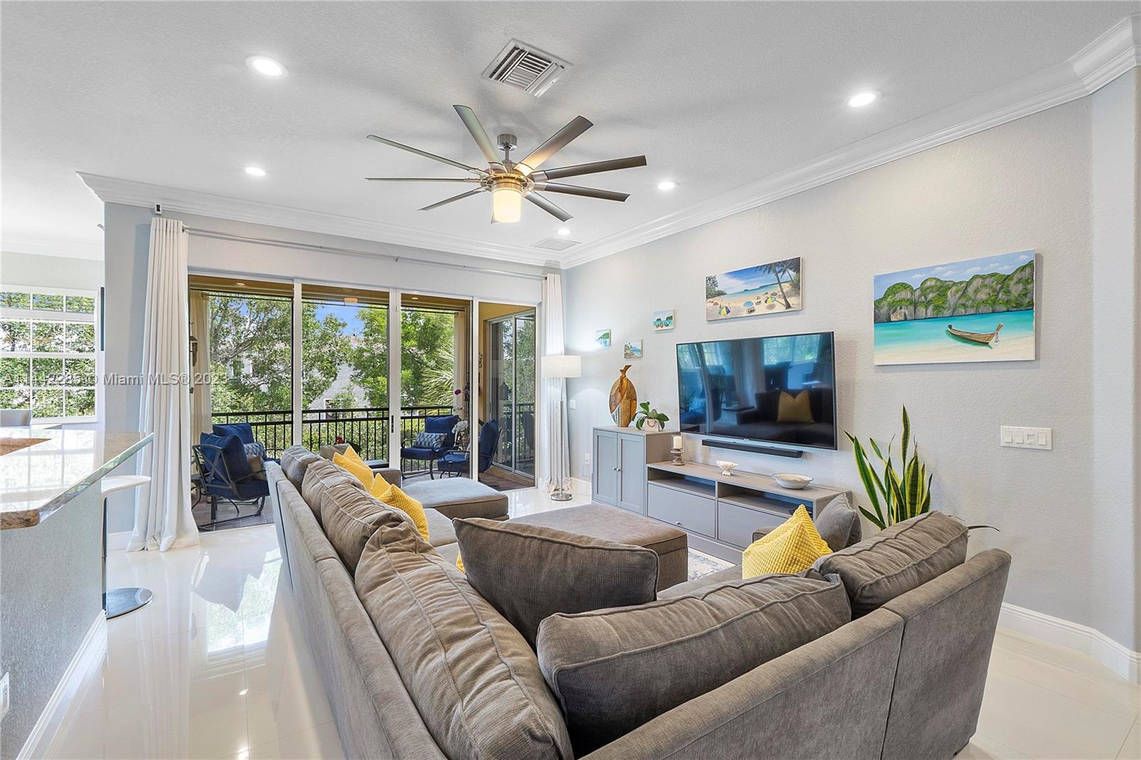 Heron Bay Parkland, FL 33076 - Photo 8 of 60 a living room with furniture and a flat screen tv