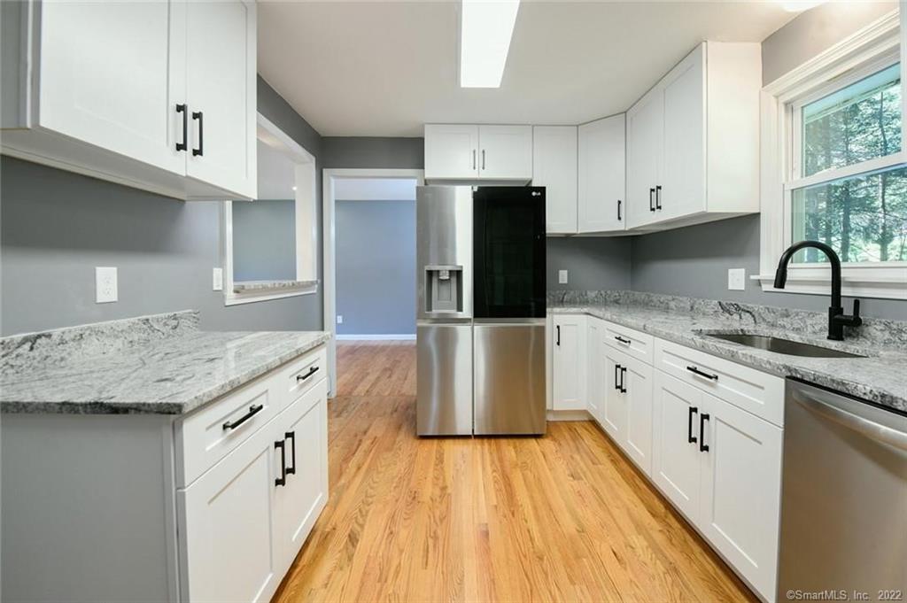 17 Stillbrook Road Avon, CT 06001 - Photo 1 of 1 a kitchen with granite countertop a sink and steel appliances