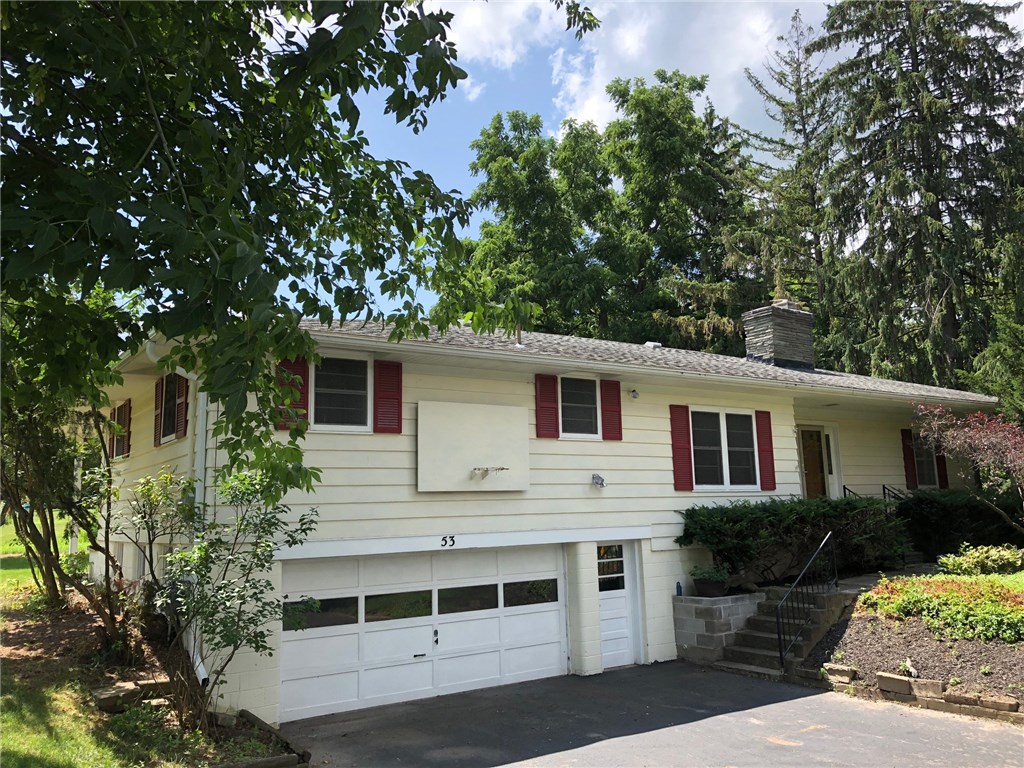 53 Knickerbocker Road Pittsford, NY 14534 - Photo 1 of 1 Front of home surrounded by mature trees and an ex