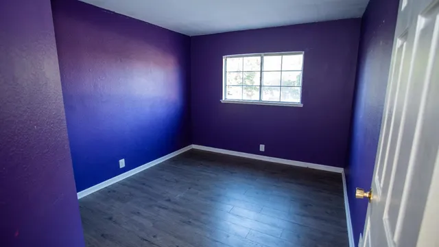 a bathroom with a toilet and shower