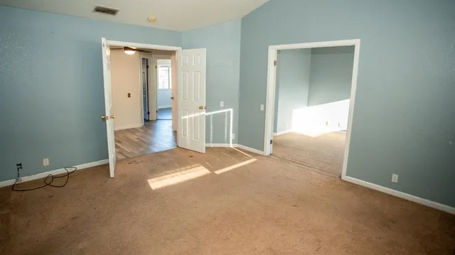 a view of a hallway with closet area