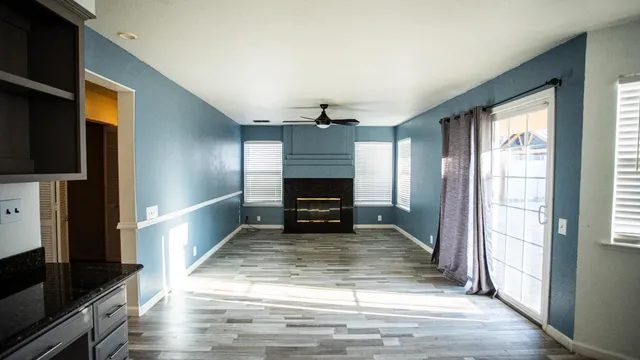 a kitchen with stainless steel appliances granite countertop a refrigerator a stove and a sink