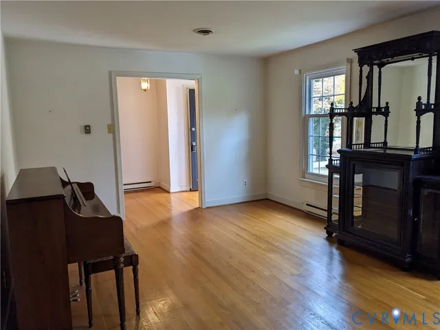 a room with furniture and a wooden floor