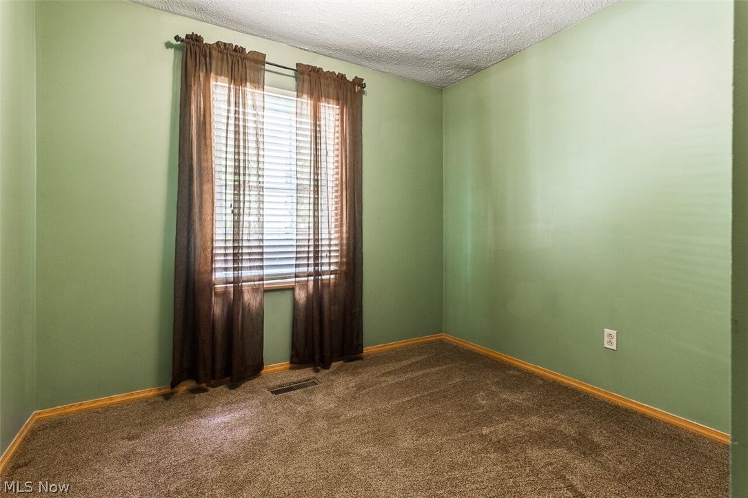 5650 Springlake Road Northwest Canton, OH 44718 - Photo 13 of 17 Second bedroom with ample closet space.