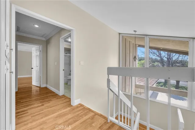 a view of an entryway with wooden floor