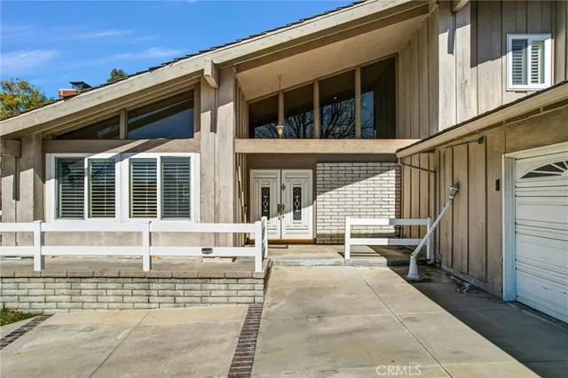 a view of a house with a large window