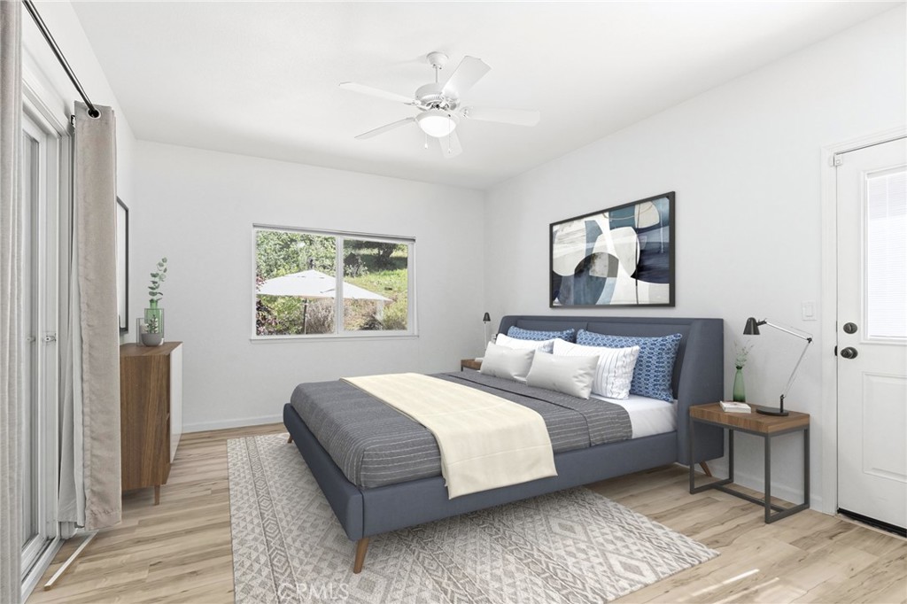 2262 Honey Run Road Chico, CA 95928 - Photo 24 of 74 a bedroom with a large bed and a window