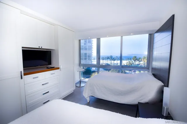 a living room with table and flat screen tv
