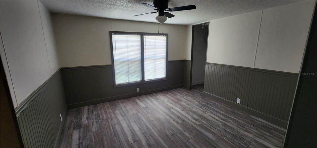 19865 Southwest 5th Place Dunnellon, FL 34431 - Photo 73 of 78 wooden floor in an empty room with a window