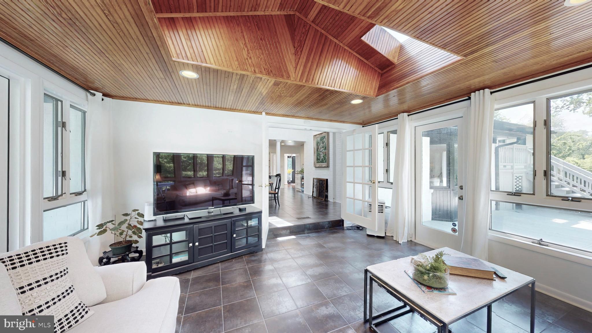 317 Springvale Road Great Falls, VA 22066 - Photo 11 of 98 a living room with furniture and a flat screen tv