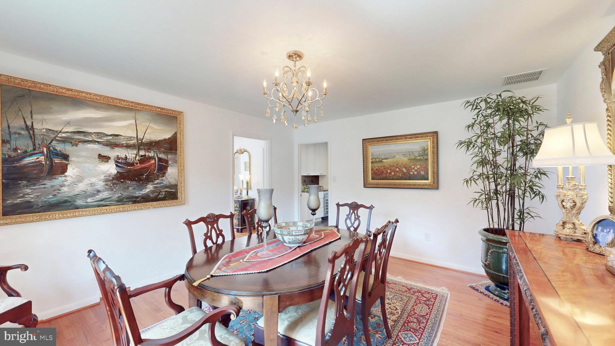 317 Springvale Road Great Falls, VA 22066 - Photo 18 of 98 a view of a dining room with furniture and chandelier