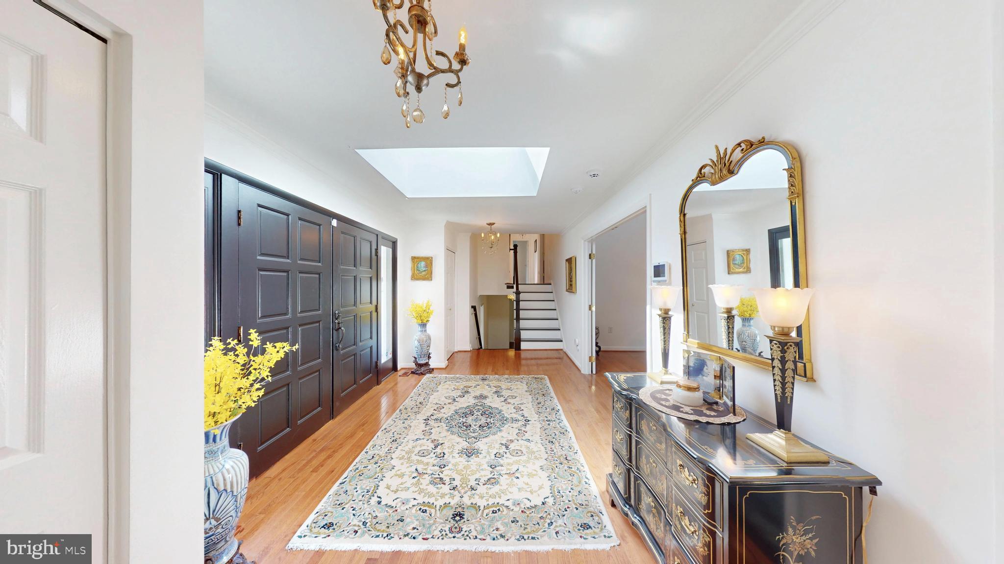 317 Springvale Road Great Falls, VA 22066 - Photo 2 of 98 a living room with furniture and a chandelier