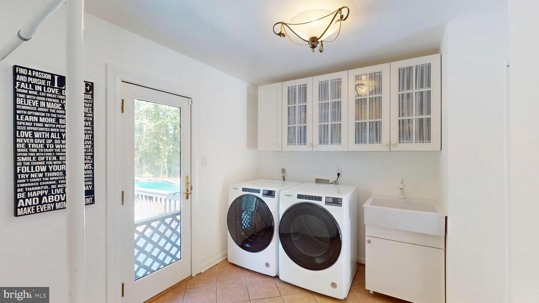 317 Springvale Road Great Falls, VA 22066 - Photo 21 of 98 a utility room with dryer and washer