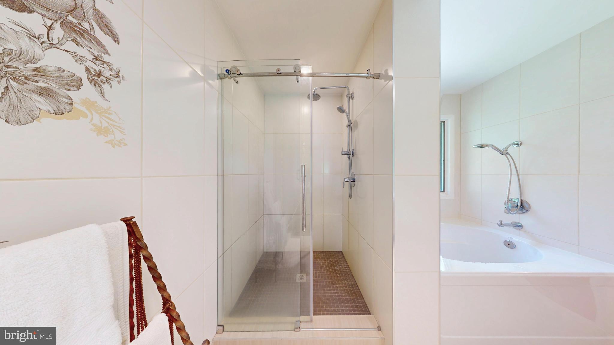 317 Springvale Road Great Falls, VA 22066 - Photo 35 of 98 a bathroom with a tub