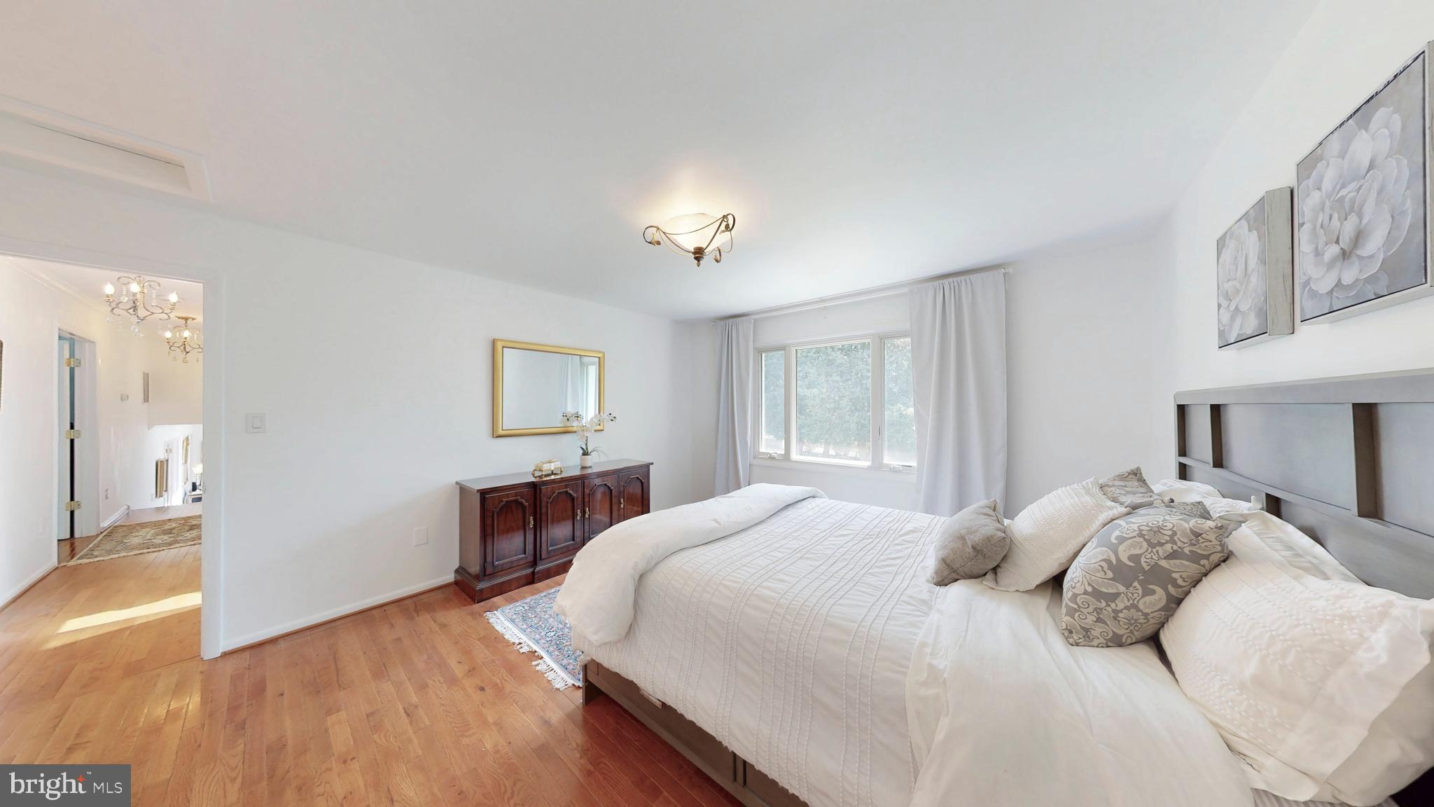 317 Springvale Road Great Falls, VA 22066 - Photo 43 of 98 a bedroom with a bed and wooden floor