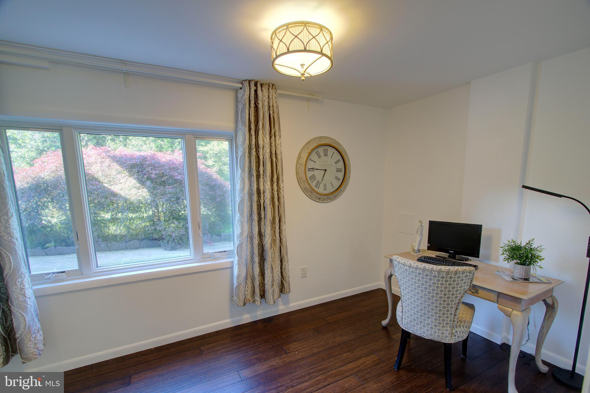 317 Springvale Road Great Falls, VA 22066 - Photo 46 of 98 a view of a dining room with furniture window and wooden floor