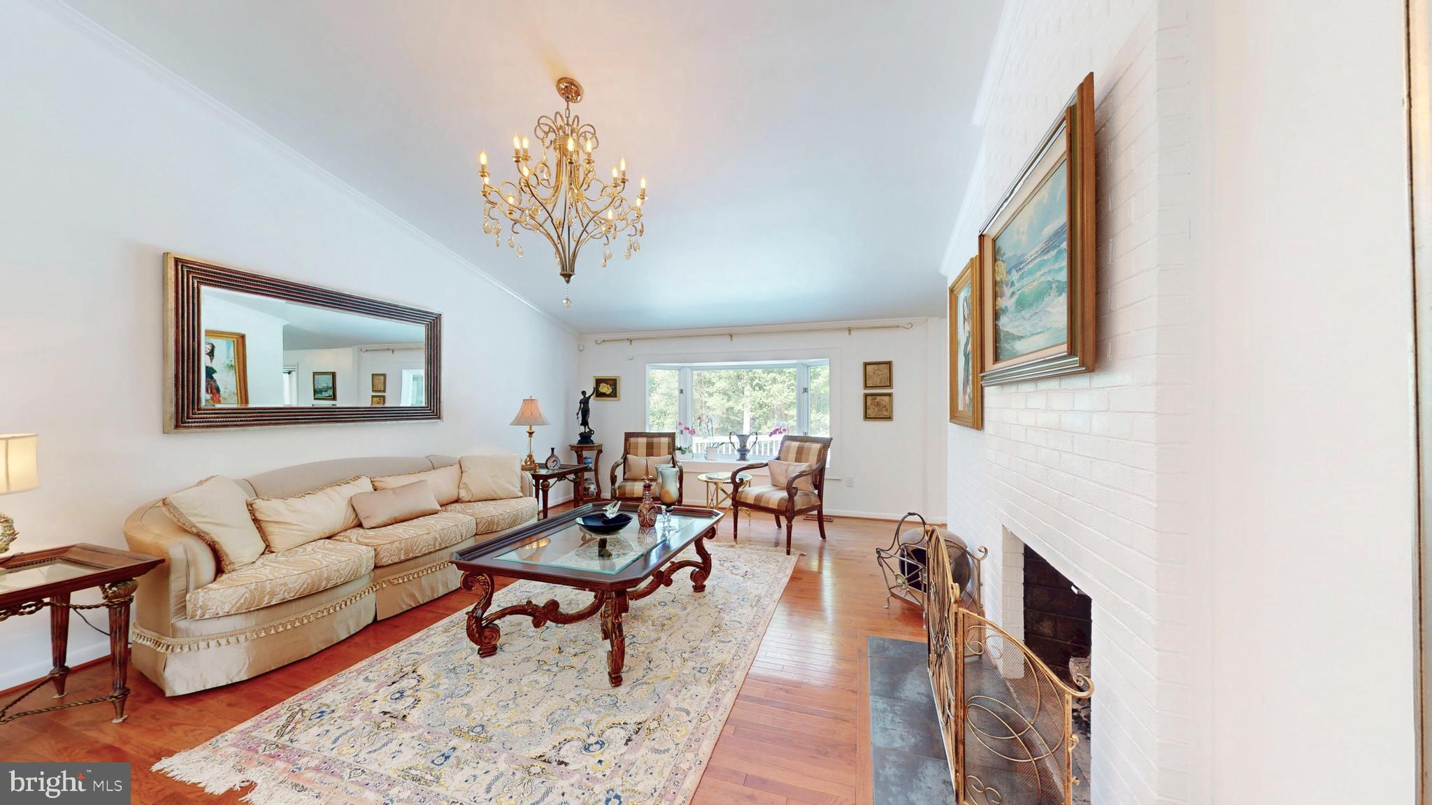 317 Springvale Road Great Falls, VA 22066 - Photo 5 of 98 a living room with furniture wooden floor and a window