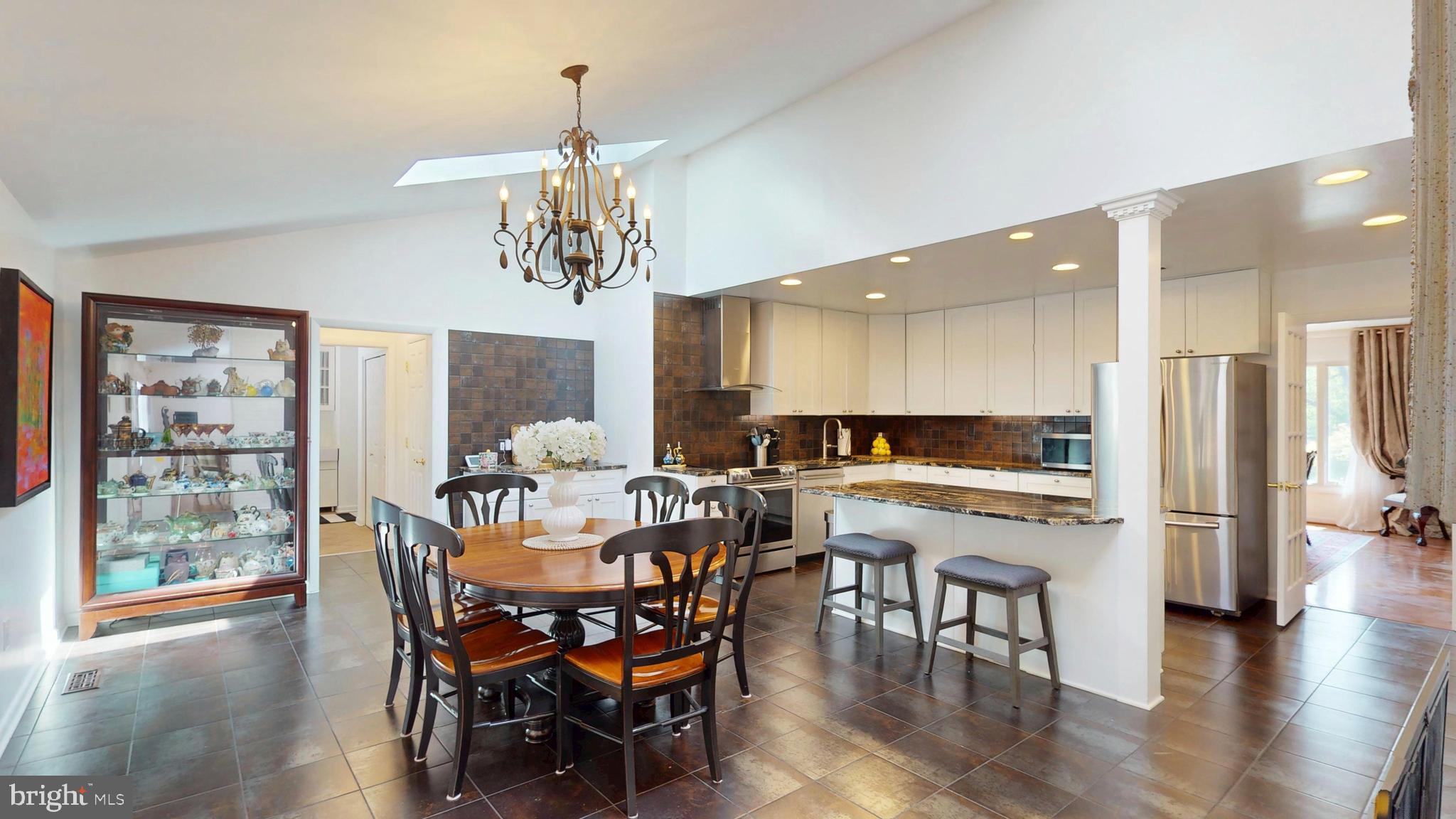 317 Springvale Road Great Falls, VA 22066 - Photo 6 of 98 a view of a dining room with furniture window and wooden floor
