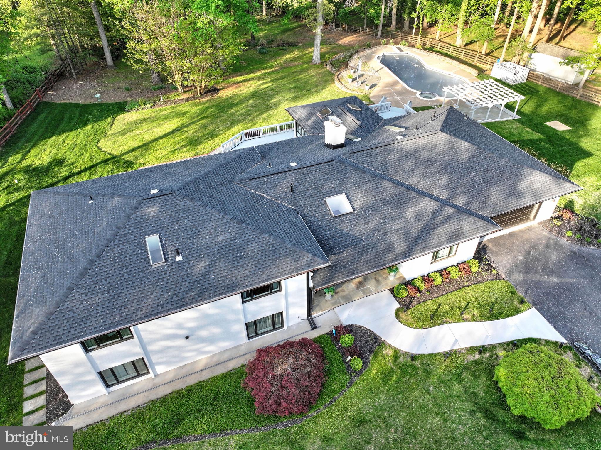317 Springvale Road Great Falls, VA 22066 - Photo 63 of 98 a backyard of a house with yard table and chairs