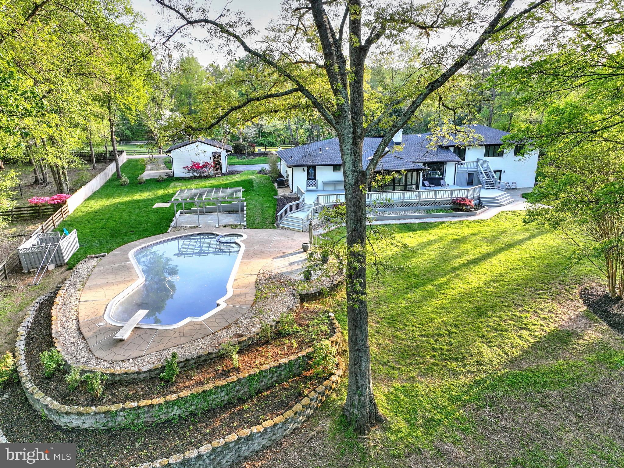 317 Springvale Road Great Falls, VA 22066 - Photo 73 of 98 a view of a house with backyard porch and sitting area