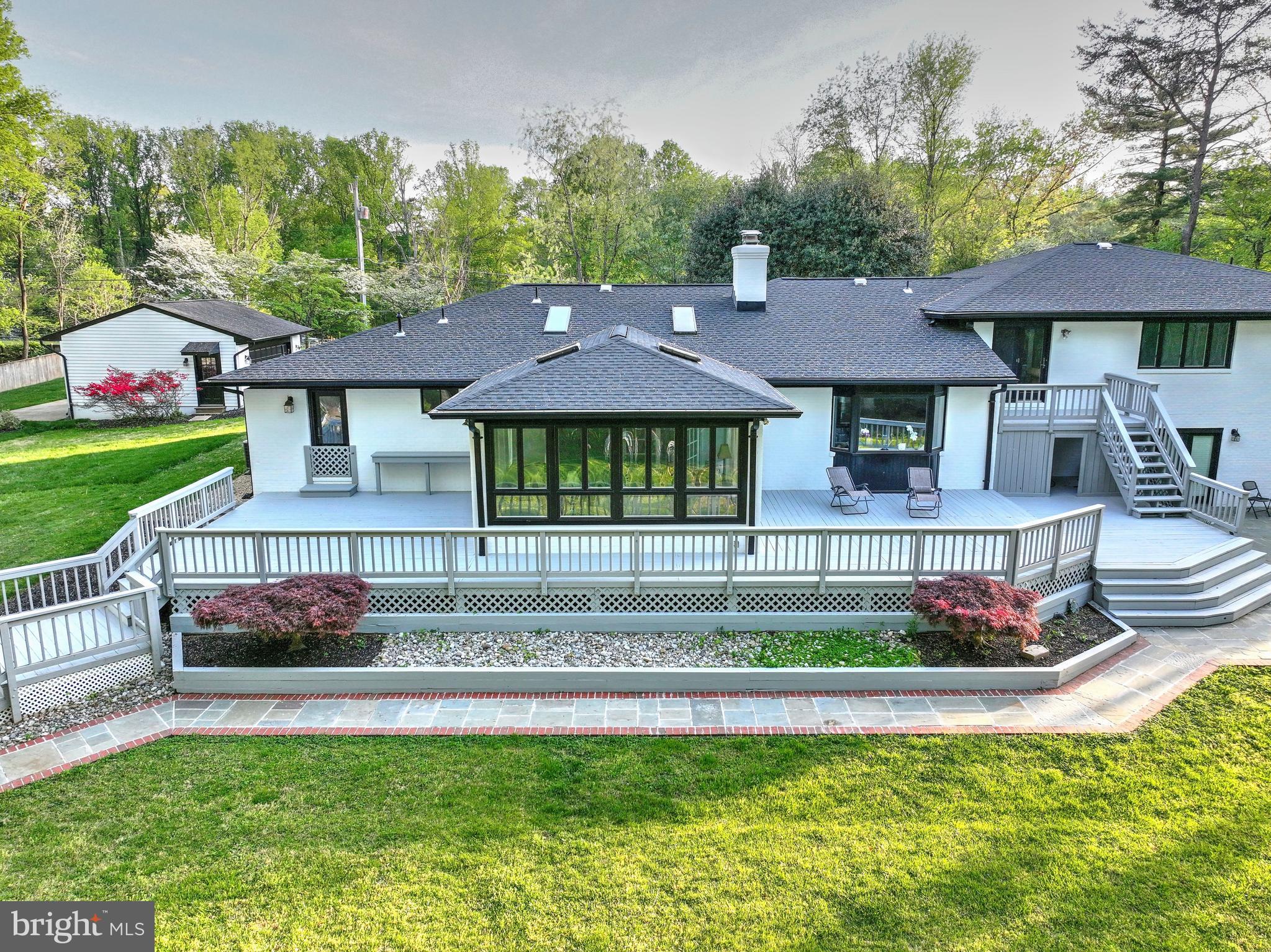 317 Springvale Road Great Falls, VA 22066 - Photo 78 of 98 a front view of a house with a yard table and chairs