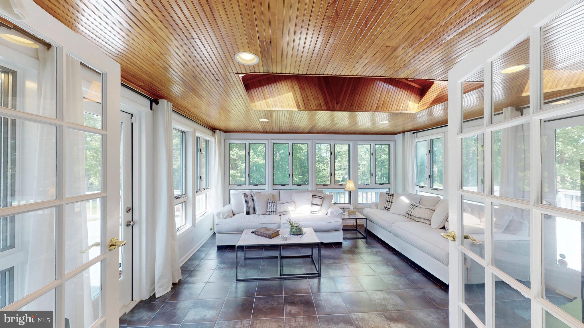 317 Springvale Road Great Falls, VA 22066 - Photo 9 of 98 a living room with furniture and a large window