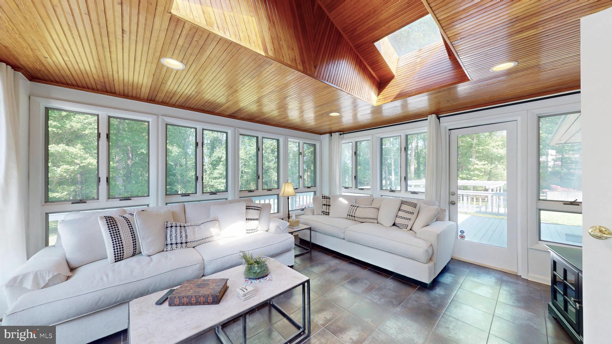 317 Springvale Road Great Falls, VA 22066 - Photo 10 of 98 a living room with furniture and a large window