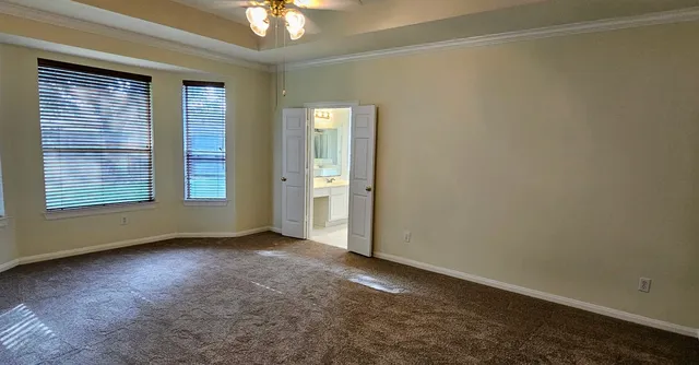 a bathroom with a tub a sink and a shower
