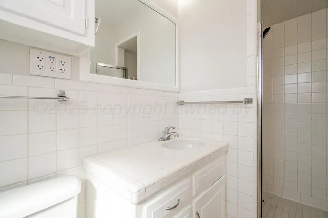 a view of a porch with wooden floor and iron stairs
