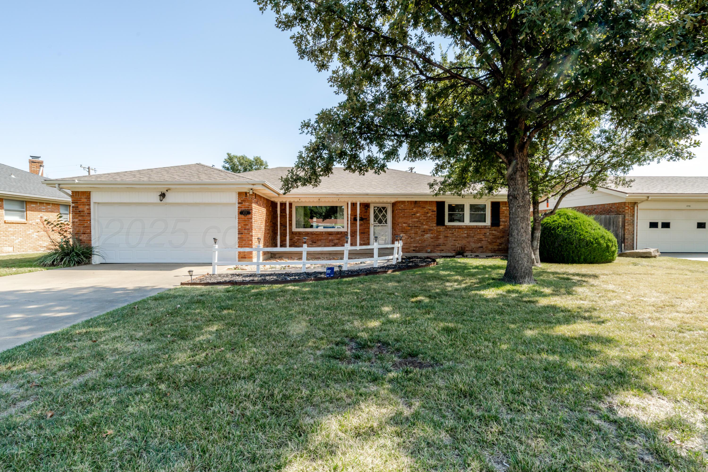 4721 Cherokee Trail Amarillo, TX 79109 - Photo 4 of 42 a view of a house with a backyard