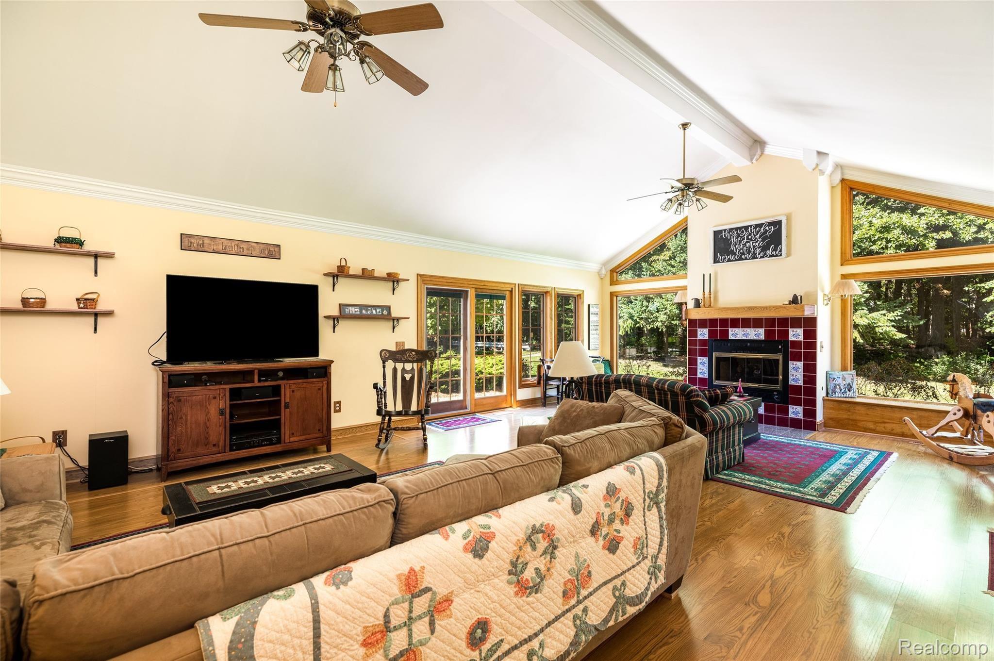 45754 Cider Mill Road Novi, MI 48374 - Photo 26 of 47 Gas Fireplace w custom surround. Two window seats overlooking woodlands
