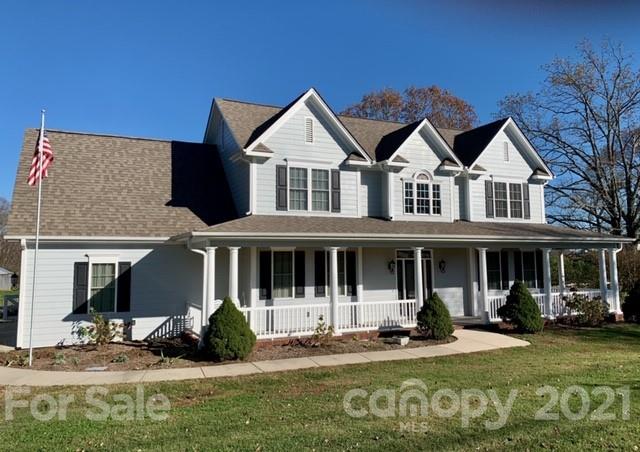4234 Horseshoe Bend Road Hudson, NC 28638 - Photo 1 of 1 a front view of a house with garden and porch