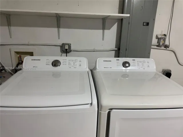 a utility room with dryer and washer